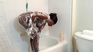 dani daniels is touching her body in the shower