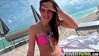 mature women fix hidden camera at the beach
