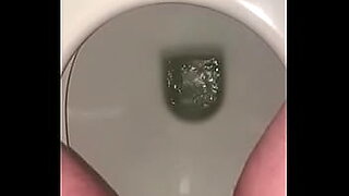 sexy girl pissing on toilet