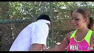 bespectacled boy fucks girl on a tennis court