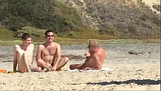 mature women fix hidden camera at the beach